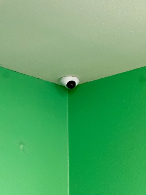 Dome camera in a classroom corner