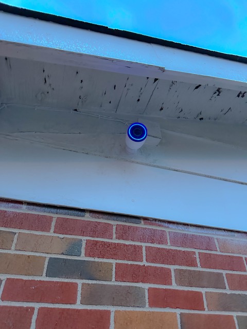 Camera above the blue entrance door