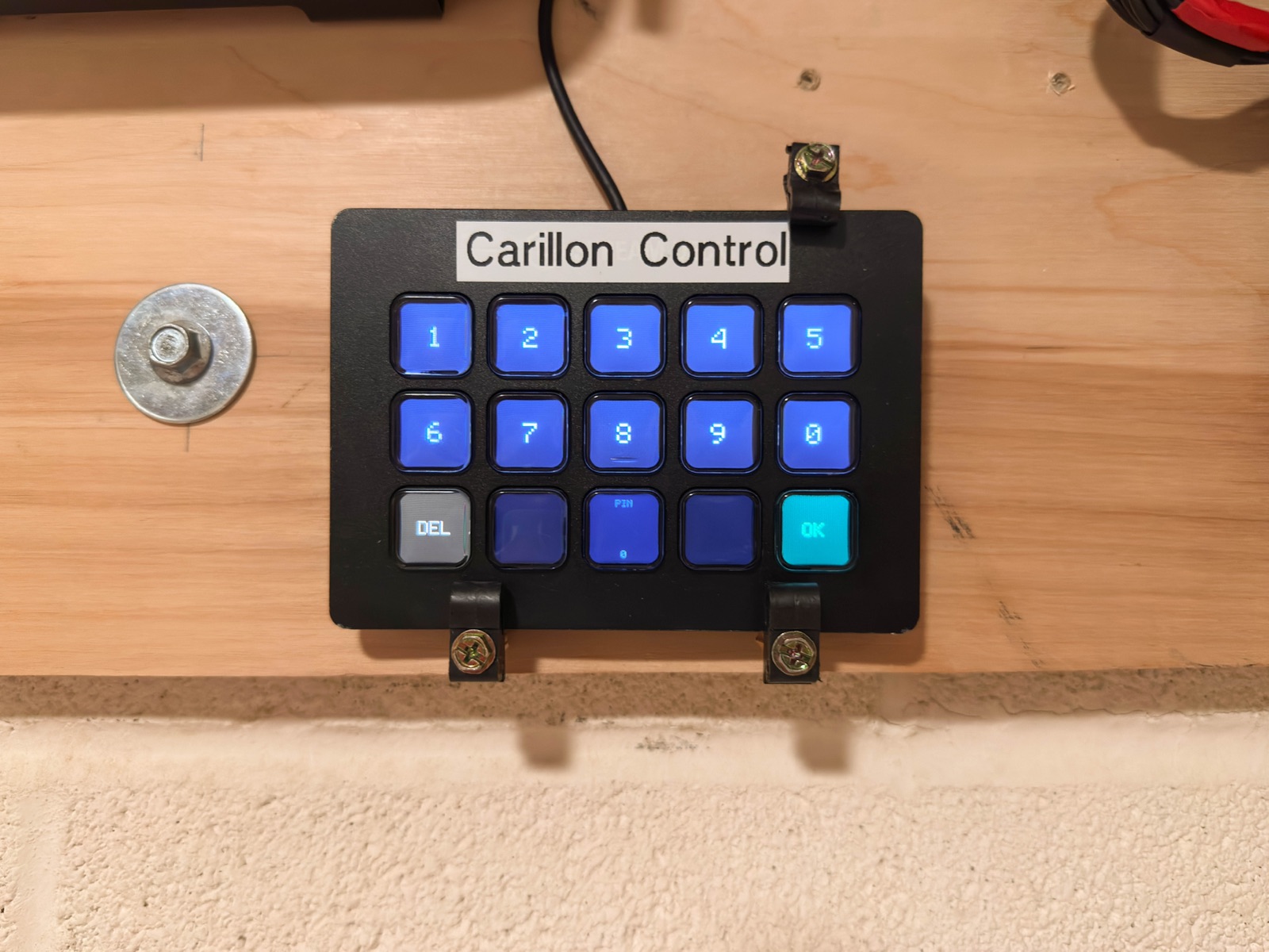Custom keypad labeled Carillon Control