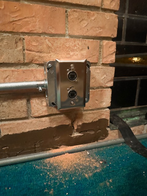 Stage connection box mounted on brick