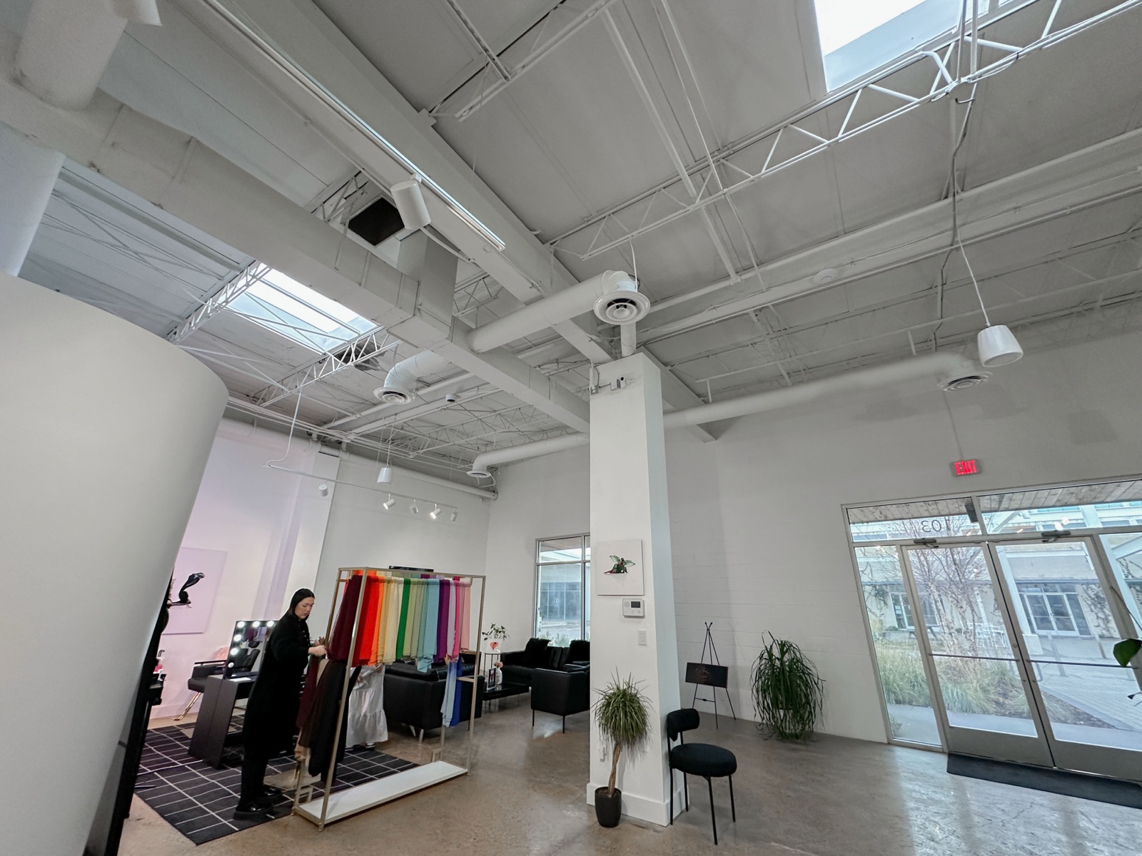 Open studio with fabric display wall and skylights