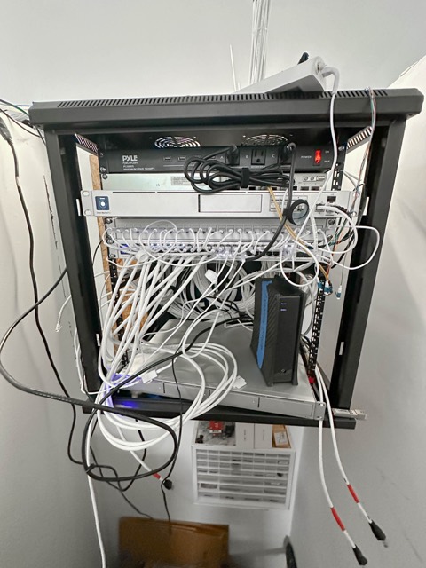 Wall cabinet before cable dressing