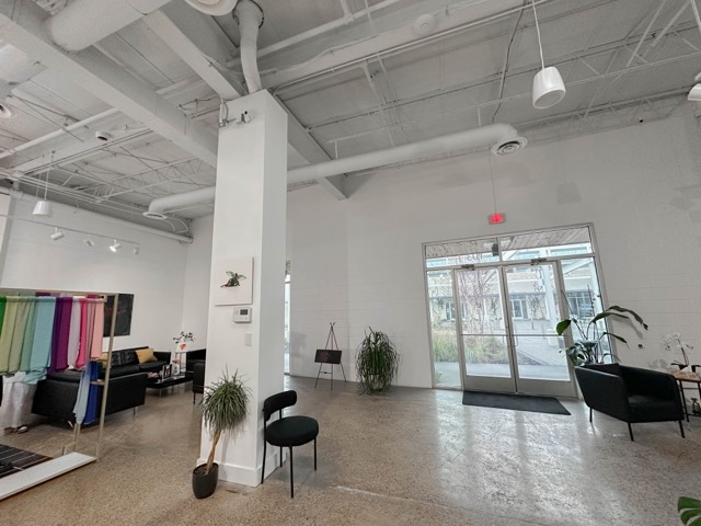 Studio entrance with plants and seating
