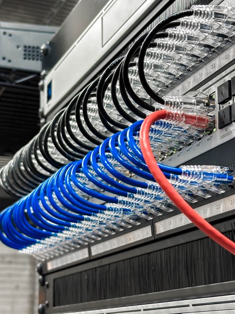 Close view of dressed patch cables entering a switch
