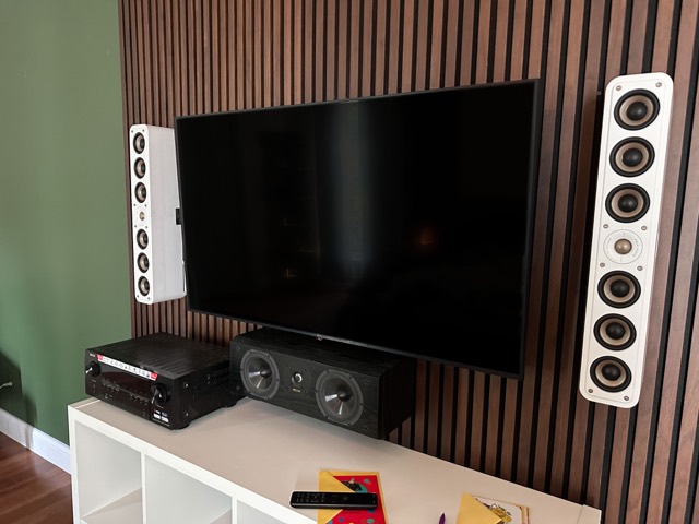 Bedroom media wall with receiver and speakers