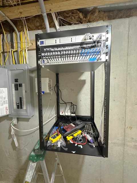 Wall rack beside the electrical panel