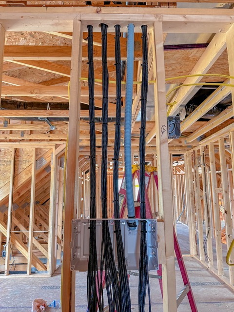 Cable runs through open framing during construction