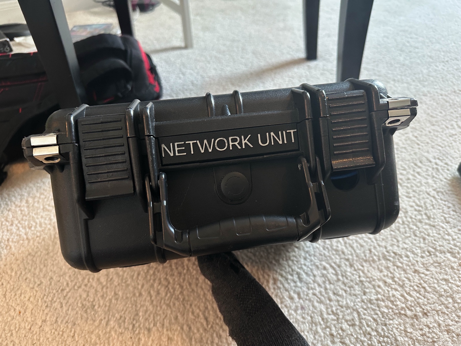 Hard case labeled Network Unit