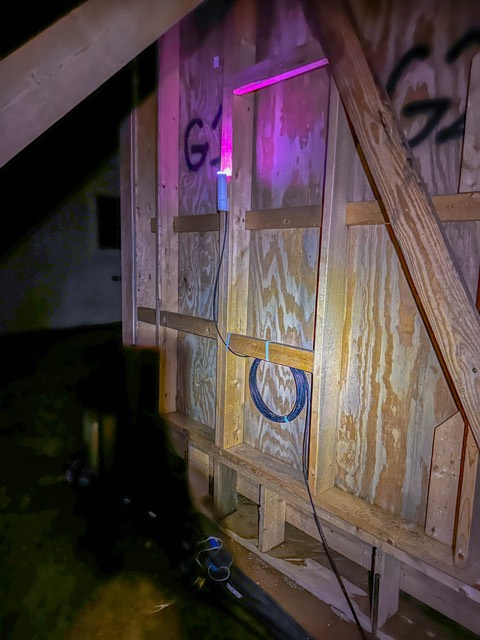 Access point hidden behind set dressing at night