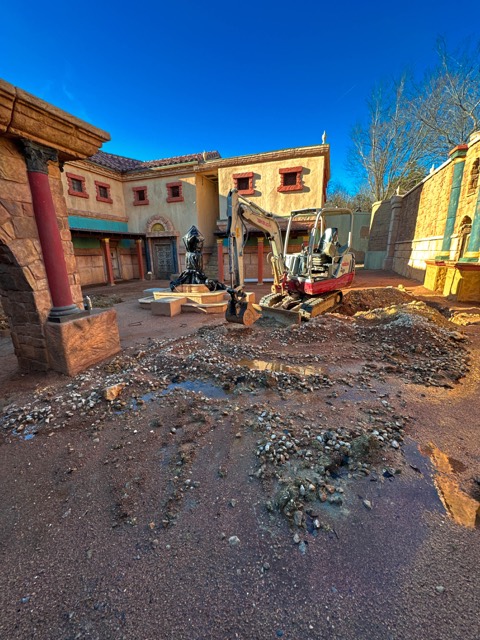 Trenching conduit down a backlot street