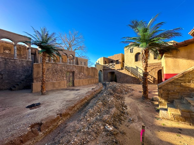 Backlot street with palms and stone facades