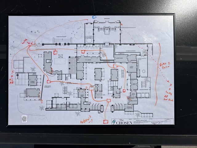 Site plan marked up with wireless coverage and cable paths