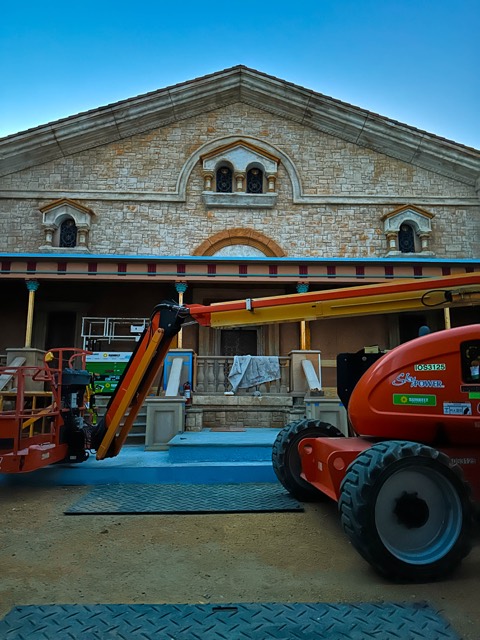 Boom lift at a set building for a rooftop install