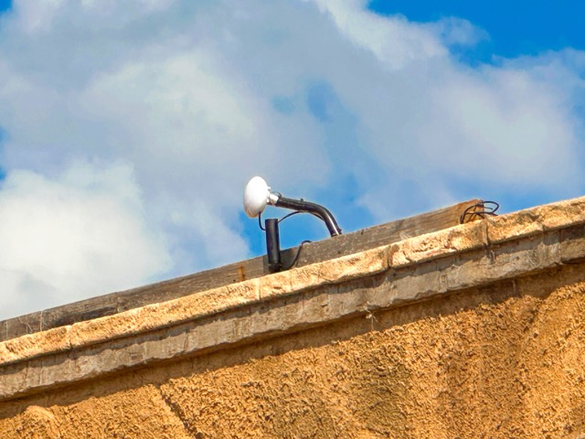 Access point mounted along a set wall