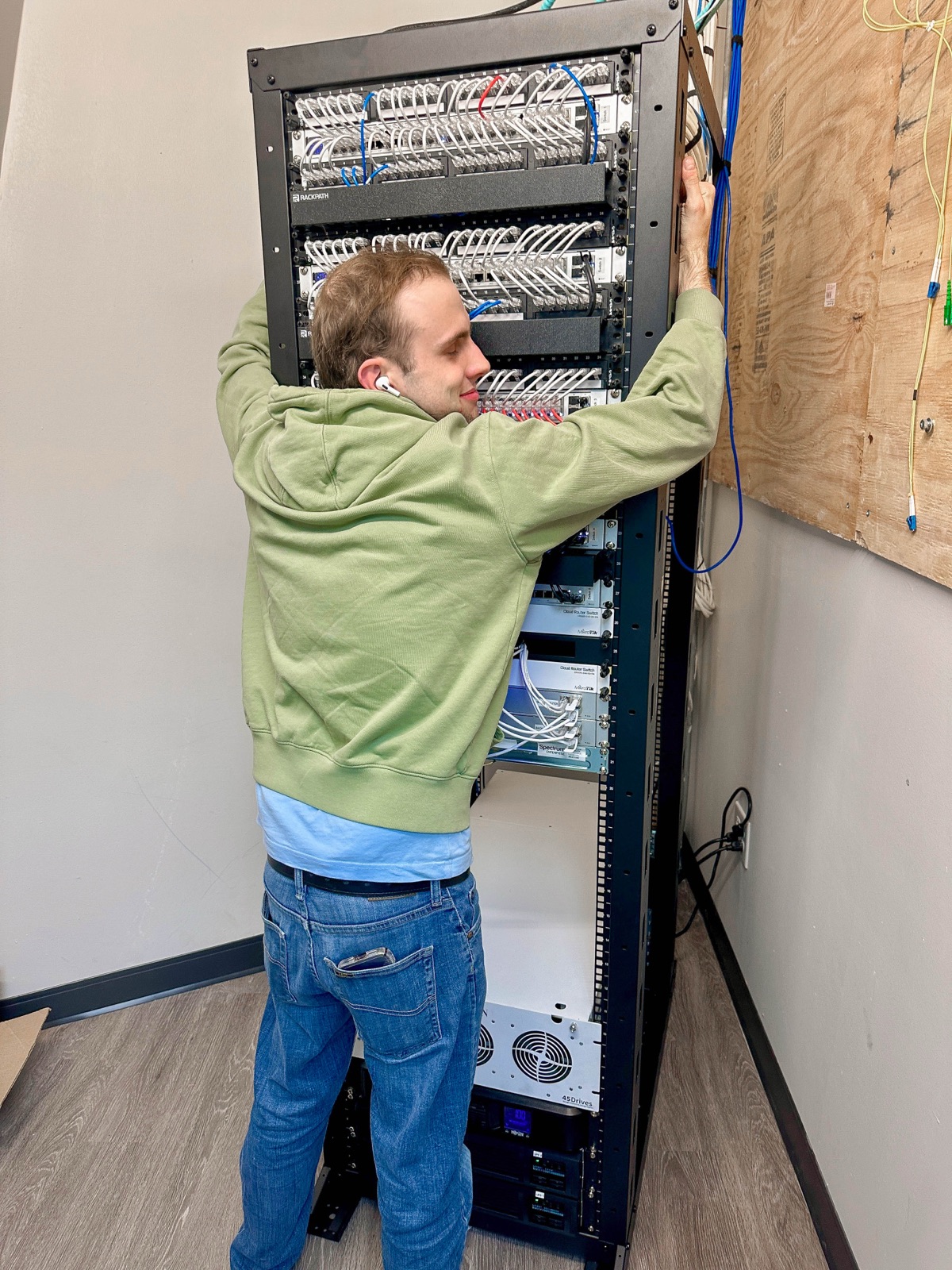 Our team hugging a freshly finished network rack