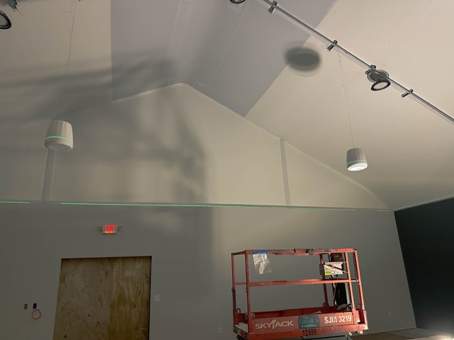 Ceiling speakers and lighting above the room