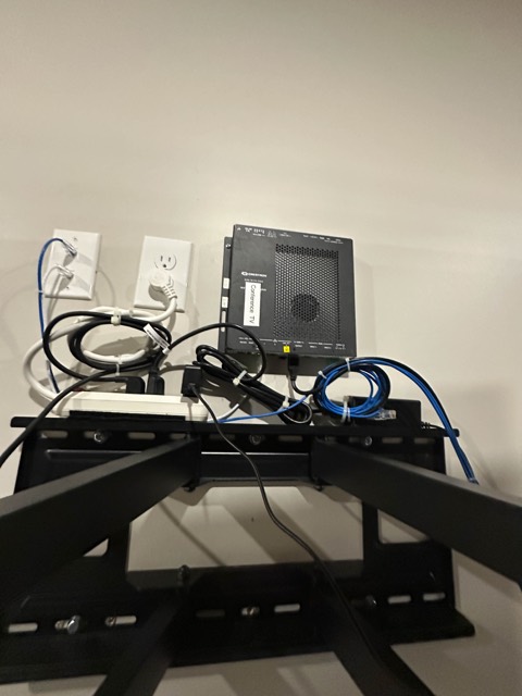 Network and power behind the display mount