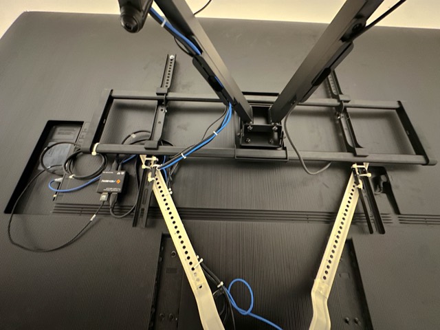 Mount arms and cabling on the wall