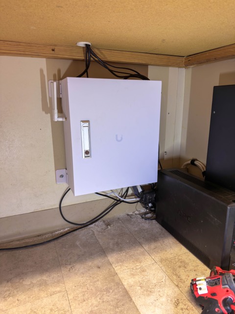 Enclosure under a desk for a remote office