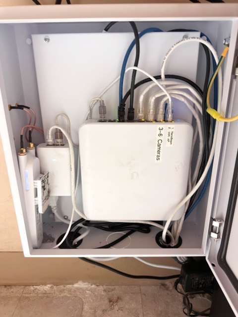 Enclosure opened to show the switch and cabling