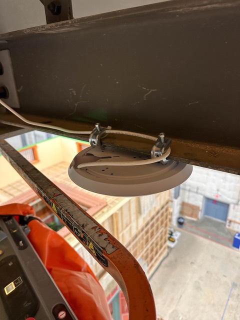 Access point mounted beneath a stage beam