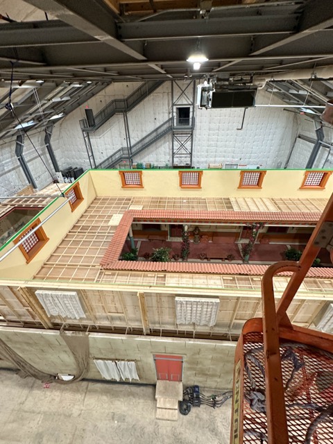 Set walls and lighting rigs from the catwalk