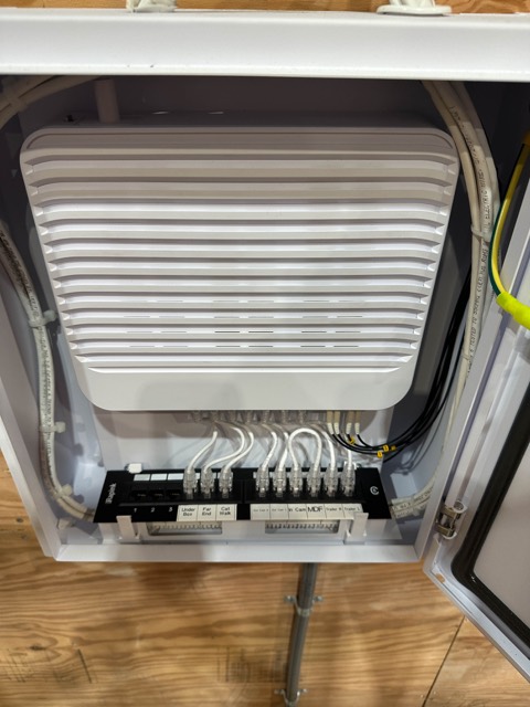 Enclosure with access point and patching on the stage wall