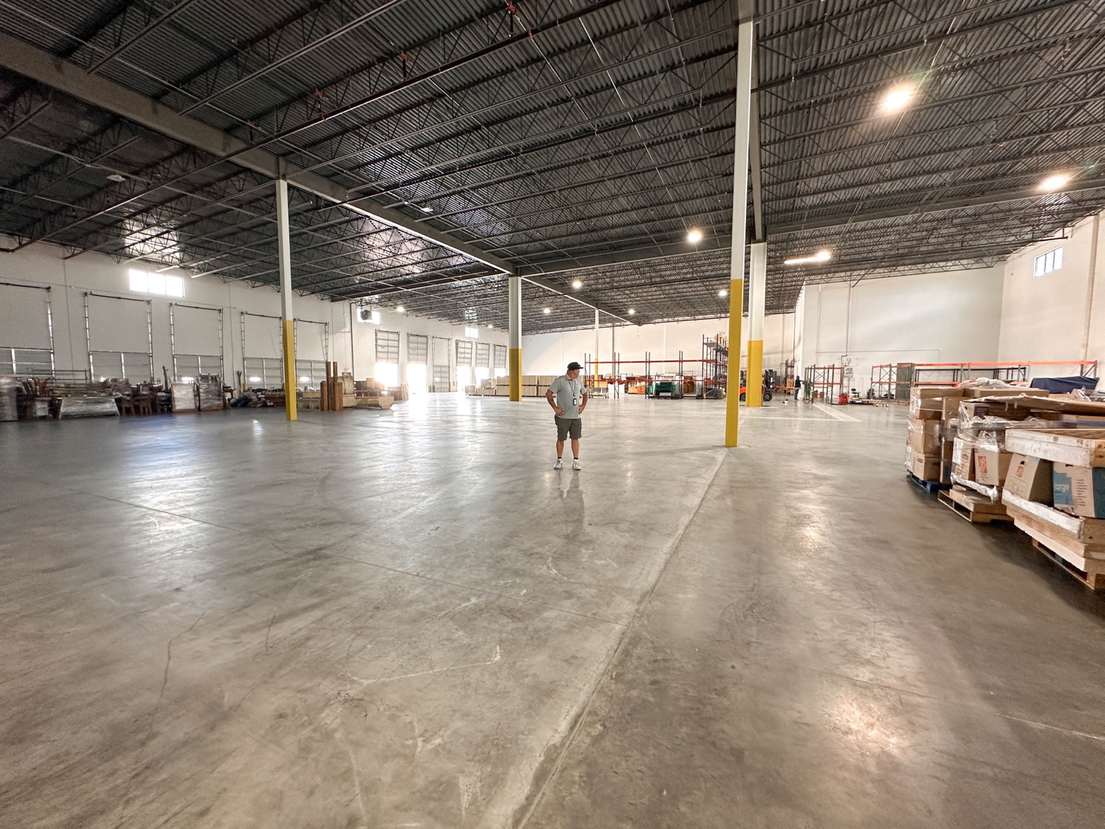Empty production warehouse with steel racking before the network went in