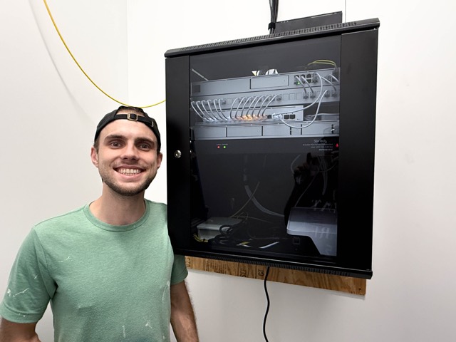 The team at the finished network cabinet