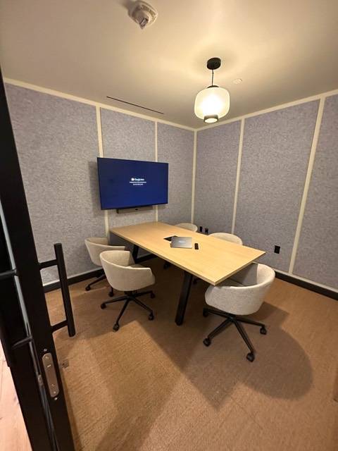 Huddle room with pendant light and display