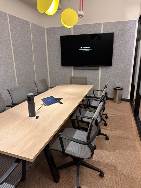 Larger meeting room with wall display
