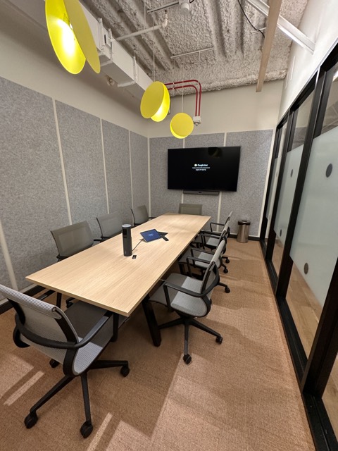 Meeting room with glass wall and display