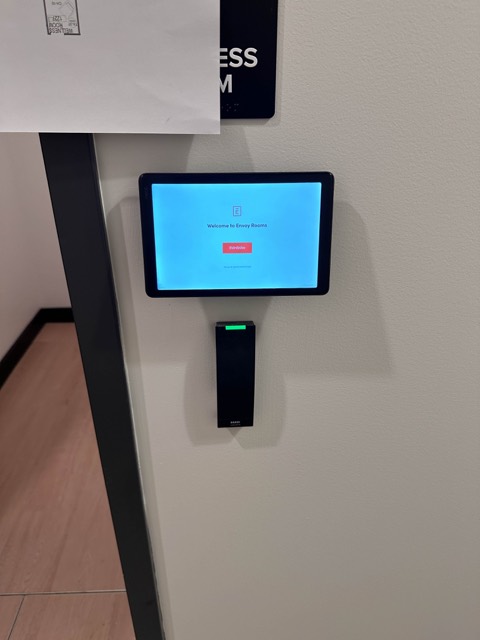 Room scheduling panel outside a meeting room