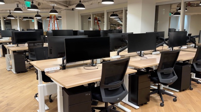 Open office desks with monitors installed